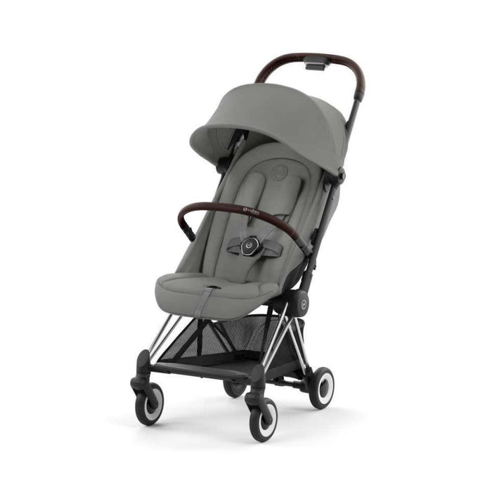 Pack Cybex Coya Chrome Dark Brown Mirage Grey + Barra de Apoio de Braços Dark Brown