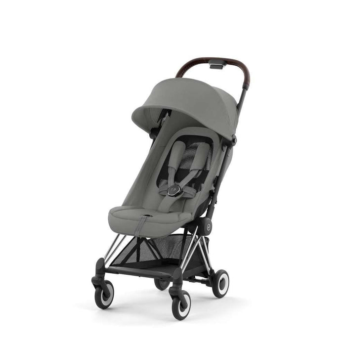 Pack Cybex Coya Chrome Dark Brown Mirage Grey + Barra de Apoio de Braços Dark Brown