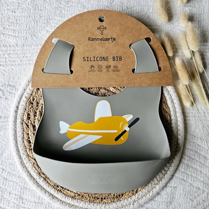 Rammelaartje Babero de silicona Sage Airplane amarillo ocre