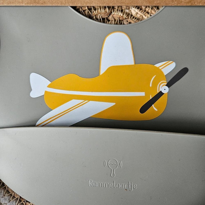 Rammelaartje Babero de silicona Sage Airplane amarillo ocre
