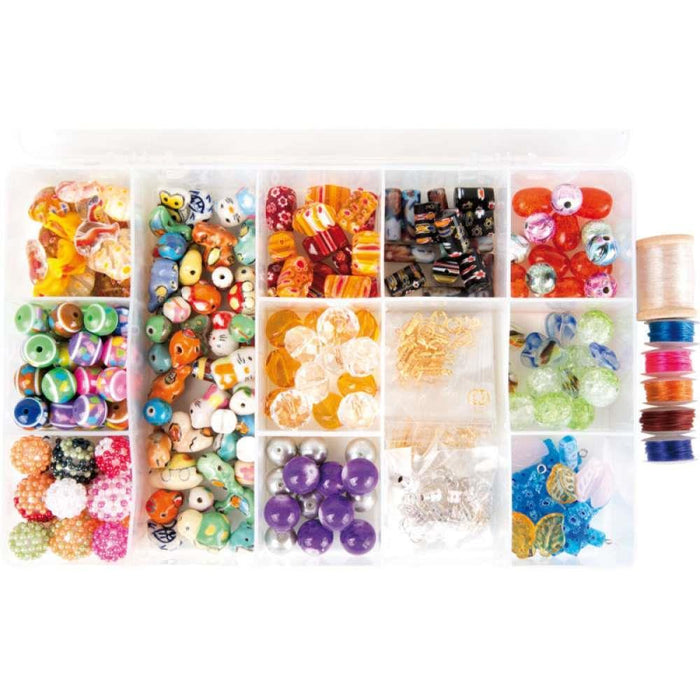 Caja con cuentas y cuentas de piedras preciosas